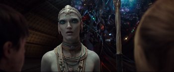 Movie still from “Valerian and the City of a Thousand Planets” (2017), directed by Luc Besson – A man with green eyes is standing in front of a sword; Close Up shot, Low angle