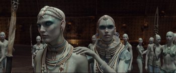 Movie still from “Valerian and the City of a Thousand Planets” (2017), directed by Luc Besson – A man and a woman dressed in costume for halloween; Medium shot, Over the shoulder angle