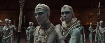 Movie still from “Valerian and the City of a Thousand Planets” (2017), directed by Luc Besson – A couple of men standing next to each other; Medium shot, Low angle