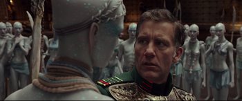 Movie still from “Valerian and the City of a Thousand Planets” (2017), directed by Luc Besson – A man in a military uniform talking to another man in a space suit; Close Up shot, Over the shoulder angle
