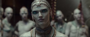 Movie still from “Valerian and the City of a Thousand Planets” (2017), directed by Luc Besson – A person wearing a costume; Close Up shot, Over the shoulder angle