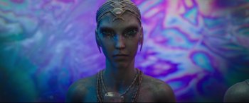Movie still from “Valerian and the City of a Thousand Planets” (2017), directed by Luc Besson – A woman with blue makeup and a head piece; Close Up shot, Low angle