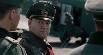Movie still from “Valkyrie” (2008), directed by Bryan Singer – A man in a military uniform and a hat; Close Up shot, Low angle