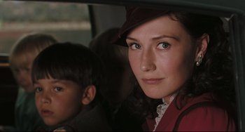Movie still from “Valkyrie” (2008), directed by Bryan Singer – A woman and a child in a car; Close Up shot, Over the shoulder angle