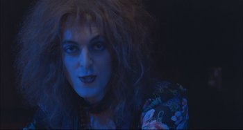 Movie still from “Velvet Goldmine” (1998), directed by Todd Haynes – A person with long hair; Close Up shot, Over the shoulder angle