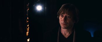 Movie still from “Venus in Fur” (2013), directed by Roman Polanski – A person wearing a black shirt; Close Up shot, Over the shoulder angle