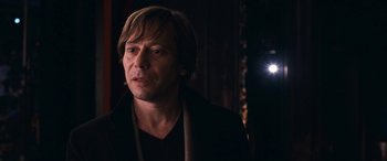 Movie still from “Venus in Fur” (2013), directed by Roman Polanski – A person wearing a black shirt; Close Up shot, Over the shoulder angle