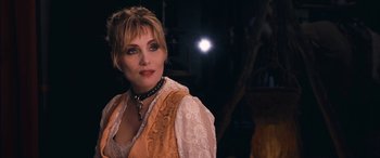Movie still from “Venus in Fur” (2013), directed by Roman Polanski – A person wearing a necklace; Close Up shot, Over the shoulder angle