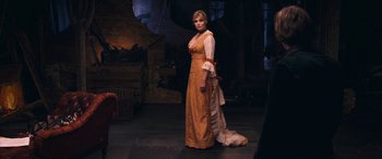 Movie still from “Venus in Fur” (2013), directed by Roman Polanski – A woman in a long dress standing on a stage; Wide shot, Over the shoulder angle