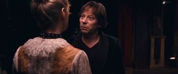 Movie still from “Venus in Fur” (2013), directed by Roman Polanski – A man and a woman looking at one another in the mirror; Close Up shot, Over the shoulder angle