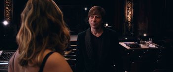 Movie still from “Venus in Fur” (2013), directed by Roman Polanski – A man and a woman are standing in front of each other; Medium shot, Over the shoulder angle
