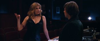 Movie still from “Venus in Fur” (2013), directed by Roman Polanski – A woman in a black dress talking to a man in a black shirt; Medium shot, Over the shoulder angle