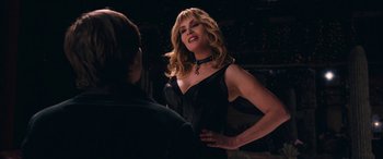 Movie still from “Venus in Fur” (2013), directed by Roman Polanski – A woman in a black dress talking to a man in a black dress; Medium shot, Over the shoulder angle