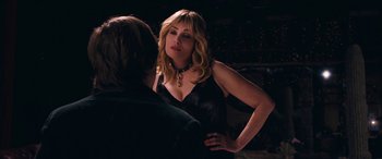 Movie still from “Venus in Fur” (2013), directed by Roman Polanski – A woman in a black dress is talking to a man in a black shirt; Close Up shot, Over the shoulder angle