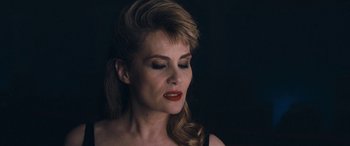 Movie still from “Venus in Fur” (2013), directed by Roman Polanski – A beautiful woman with long blonde hair and red lipstick; Close Up shot, High angle