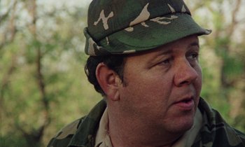 Movie still from “Vernon, Florida” (1981), directed by Errol Morris – A person wearing a hat; Close Up shot, Over the shoulder angle