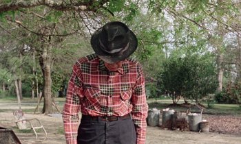Movie still from “Vernon, Florida” (1981), directed by Errol Morris – An older man in a cowboy hat and plaid shirt; Medium shot, Low angle