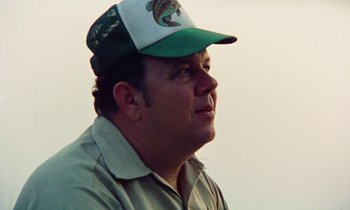 Movie still from “Vernon, Florida” (1981), directed by Errol Morris – A person wearing a hat; Close Up shot, Low angle