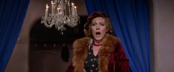Movie still from “Victor/Victoria” (1982), directed by Blake Edwards – An older woman wearing a hat and a fur coat; Close Up shot, Low angle