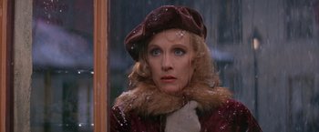 Movie still from “Victor/Victoria” (1982), directed by Blake Edwards – A woman wearing a brown hat and a fur coat; Close Up shot, Over the shoulder angle