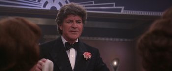 Movie still from “Victor/Victoria” (1982), directed by Blake Edwards – A person wearing a suit and tie; Close Up shot, Low angle