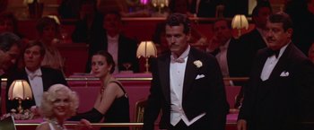 Movie still from “Victor/Victoria” (1982), directed by Blake Edwards – A man in a black tuxedo and a woman in a black dress; Medium shot, Over the shoulder angle
