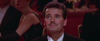 Movie still from “Victor/Victoria” (1982), directed by Blake Edwards – A person wearing a suit and tie; Close Up shot, Low angle
