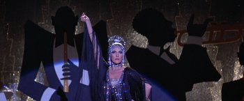 Movie still from “Victor/Victoria” (1982), directed by Blake Edwards – A woman in a costume on a stage; Medium shot, Low angle