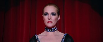 Movie still from “Victor/Victoria” (1982), directed by Blake Edwards – A person wearing a necklace; Close Up shot, Low angle
