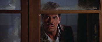 Movie still from “Victor/Victoria” (1982), directed by Blake Edwards – A person looking through a window; Close Up shot, Low angle