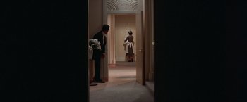 Movie still from “Victor/Victoria” (1982), directed by Blake Edwards – A man and a woman are standing in a room; Wide shot, Low angle