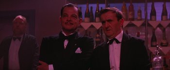 Movie still from “Victor/Victoria” (1982), directed by Blake Edwards – Two men in tuxedos standing next to each other; Close Up shot, Low angle