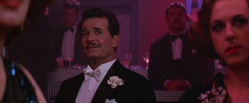 Movie still from “Victor/Victoria” (1982), directed by Blake Edwards – A man in a tuxedo with a flower in his lapel; Close Up shot, Low angle