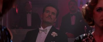 Movie still from “Victor/Victoria” (1982), directed by Blake Edwards – A man in a suit and bow tie looking up; Close Up shot, Low angle