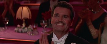 Movie still from “Victor/Victoria” (1982), directed by Blake Edwards – A person wearing a suit and bow tie; Close Up shot, Low angle