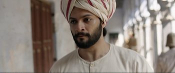Movie still from “Victoria & Abdul” (2017), directed by Stephen Frears – A man with a beard wearing a turban; Close Up shot, Low angle