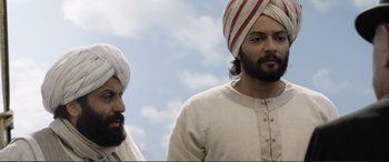 Movie still from “Victoria & Abdul” (2017), directed by Stephen Frears – Two men with beards and turbans standing next to each other; Close Up shot, Low angle