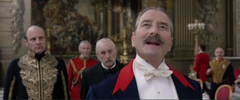 Movie still from “Victoria & Abdul” (2017), directed by Stephen Frears – A group of men standing next to each other in a room; Close Up shot, Low angle