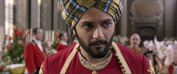 Movie still from “Victoria & Abdul” (2017), directed by Stephen Frears – A person wearing a turban; Close Up shot, Over the shoulder angle