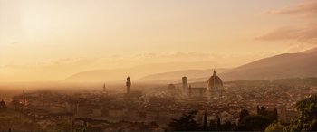 Movie still from “Victoria & Abdul” (2017), directed by Stephen Frears – A view of a city skyline at sunset with the dome of the cathedral in the distance; Extreme Wide shot, High angle
