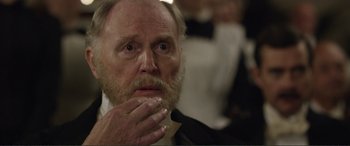 Movie still from “Victoria & Abdul” (2017), directed by Stephen Frears – An older man with a beard and mustache; Close Up shot, Over the shoulder angle