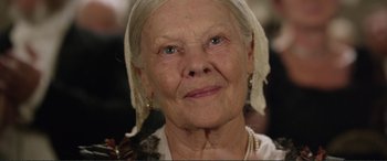 Movie still from “Victoria & Abdul” (2017), directed by Stephen Frears – An older woman with a white head covering; Close Up shot, Low angle