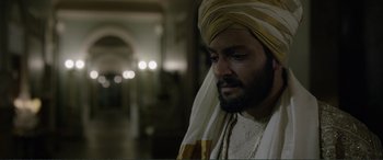 Movie still from “Victoria & Abdul” (2017), directed by Stephen Frears – A man with a beard wearing a turban; Close Up shot, Over the shoulder angle