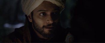 Movie still from “Victoria & Abdul” (2017), directed by Stephen Frears – A person with a beard wearing a turban; Close Up shot, Over the shoulder angle
