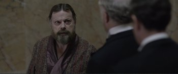 Movie still from “Victoria & Abdul” (2017), directed by Stephen Frears – A man with a long beard looking into a mirror with another man; Close Up shot, Over the shoulder angle