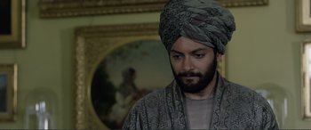Movie still from “Victoria & Abdul” (2017), directed by Stephen Frears – A man with a beard and a turban in a room; Close Up shot, Over the shoulder angle