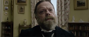 Movie still from “Victoria & Abdul” (2017), directed by Stephen Frears – An old man with a beard and a mustache; Close Up shot, Over the shoulder angle