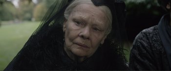 Movie still from “Victoria & Abdul” (2017), directed by Stephen Frears – An older woman with a black dress and a black veil; Close Up shot, Low angle