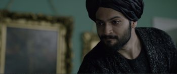 Movie still from “Victoria & Abdul” (2017), directed by Stephen Frears – A man with a beard wearing a turban; Close Up shot, Over the shoulder angle