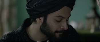 Movie still from “Victoria & Abdul” (2017), directed by Stephen Frears – A person wearing a turban; Close Up shot, Over the shoulder angle